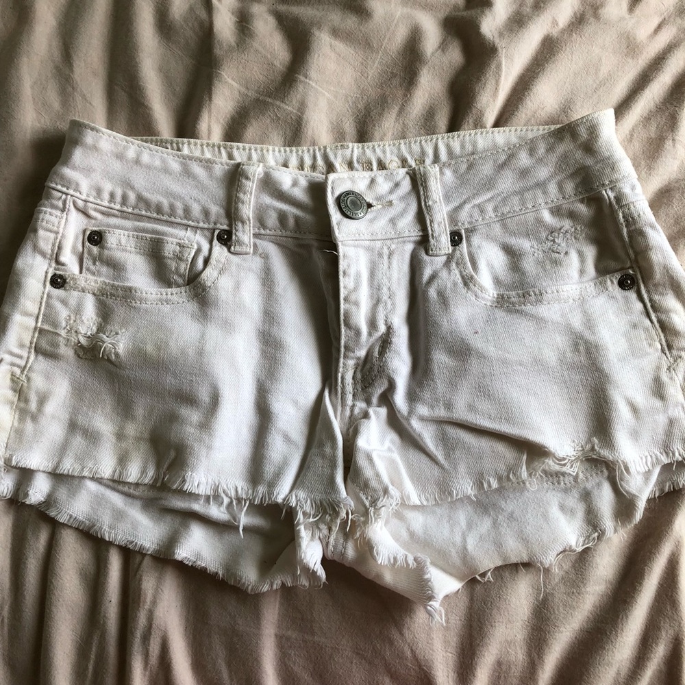 White denim distressed shorts